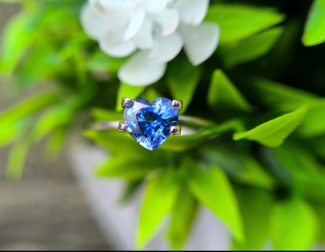 Blue sapphire GS-000002 shown held in a display setting; gemstone-only listing